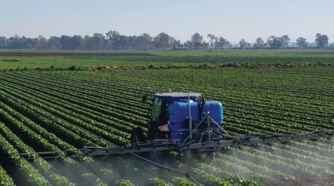 An LS Spraying a crop