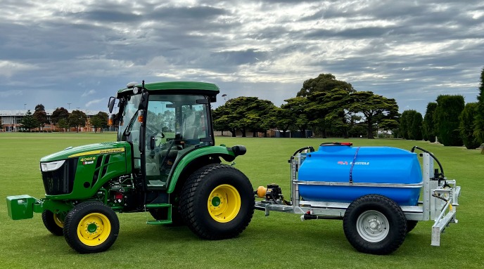 Turf sprayer connected to a tractor