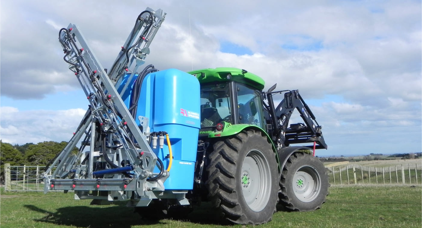 LS with boom closed on the back of a tractor