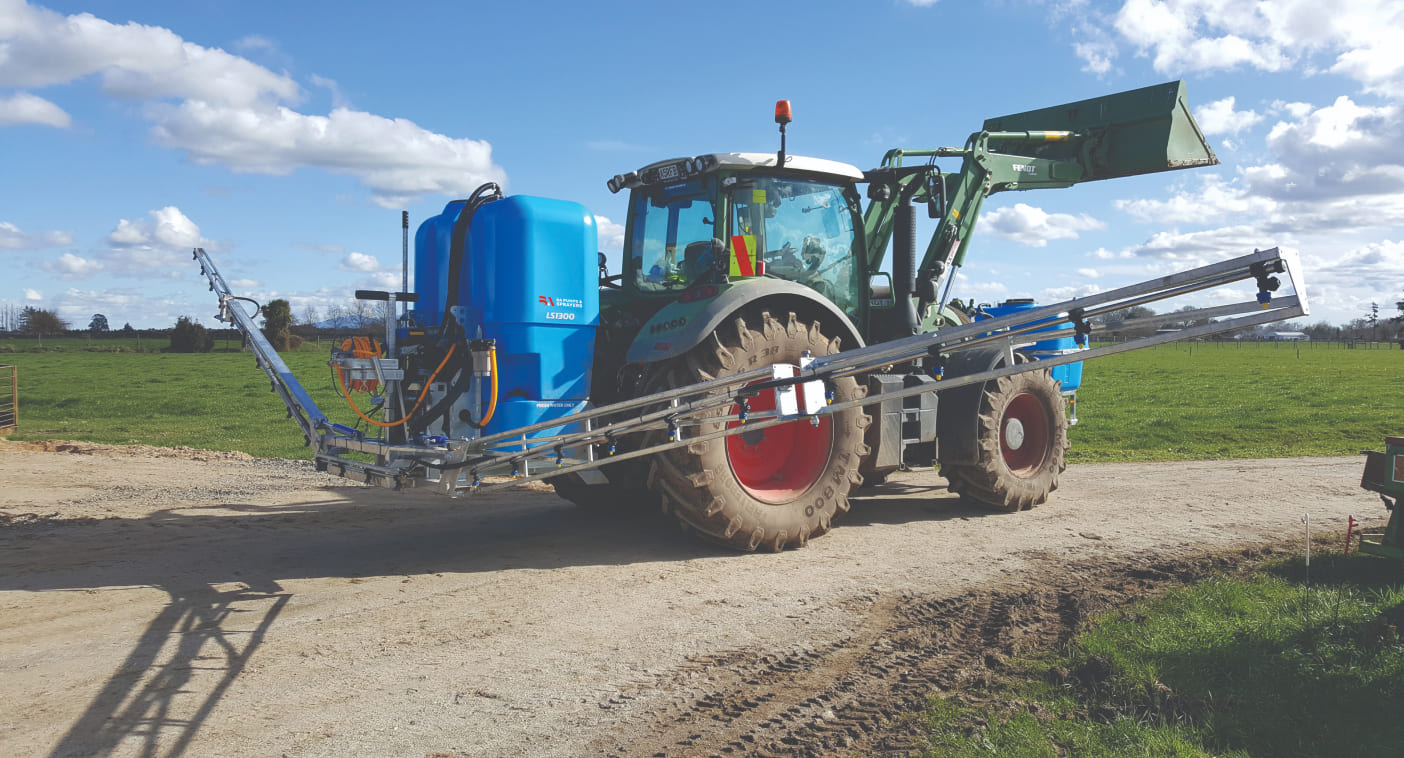 LS on the back of a tractor with open boom