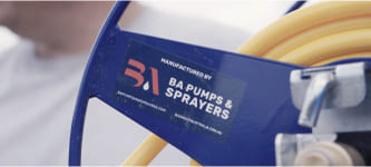 Close up of a BA Pumps & Sprayers sticker on a hose reel