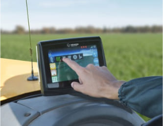 Hexagon GPS unit in a tractor cab