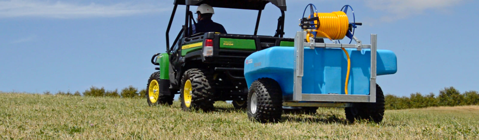 Man towing a TSX400 Trailed Sprayer