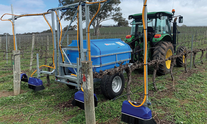 Under Vine Sprayer spraying in a vineyard