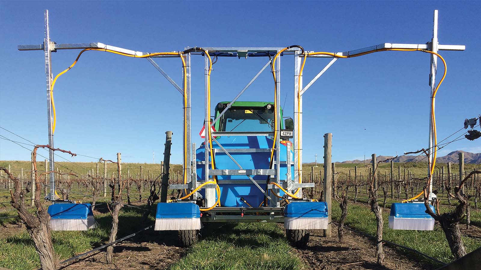 Under Vine Sprayer spraying in a vineyard