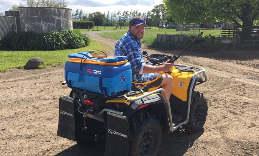 Man on a Quad Bike with an EZI-Spot Sprayer
