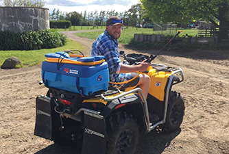 Man on a Quad Bike with an EZI-Spot Sprayer