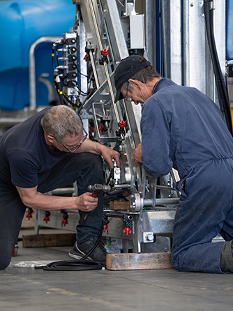 BA staff working on a Linkage Sprayer