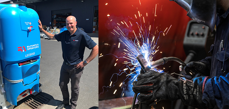Mark Harris standing next to an LS Linkage Sprayer and a welder in the fab shop.