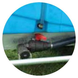 Close up of tank drain and bottom fill