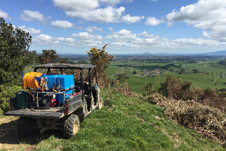 Deckmount sprayer on a n ATV looking over the hills of the waikato