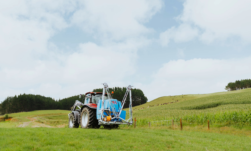 LM on a tractor closed up on a field