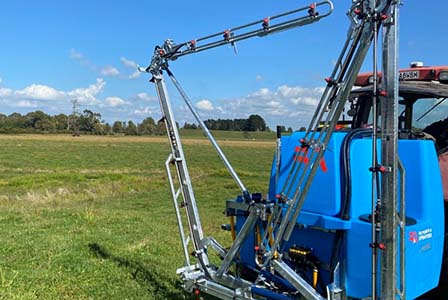 M Boom opening up on the back of a LM Sprayer.